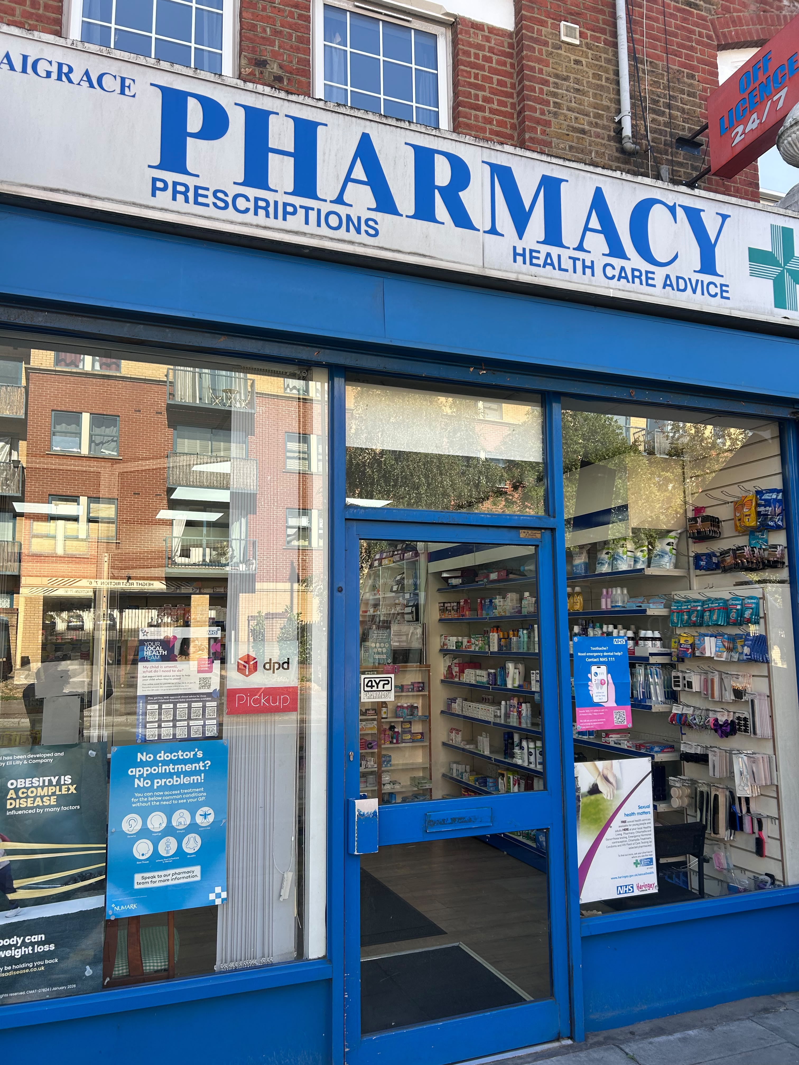 The blue Saigrace Pharmacy shopfront on Tottenham Lane, Hornsey